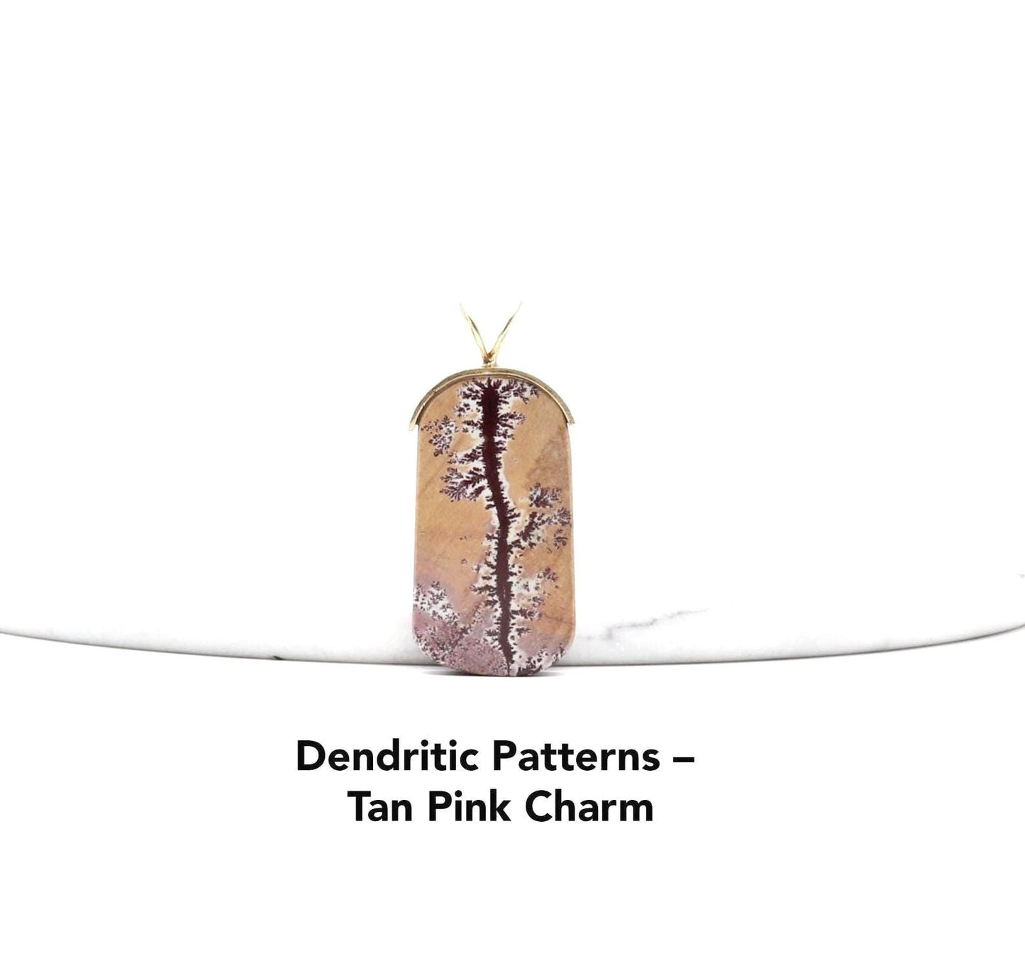 Sonoran Dendritic Rhyolite Pendant – Brass Bail shown against white marble with text overlay Dendritic Patterns - Tan Pink Charm