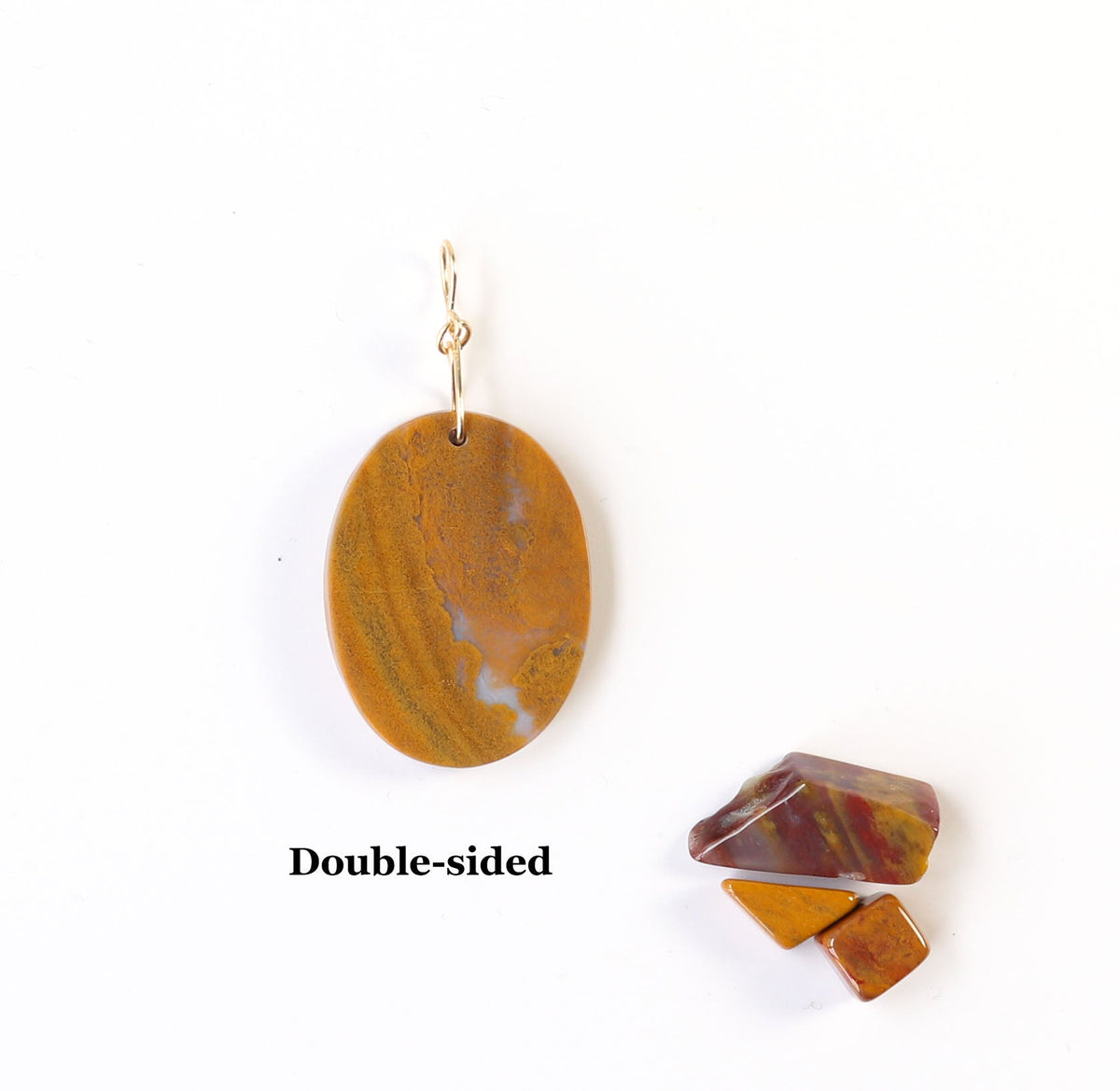 Reverse side of sonoran sunrise ochre and white crystal veining pendant. Shown on white background with pebbles of polished sonoran sunrise shown for props. Text overlay reads Double-sided.