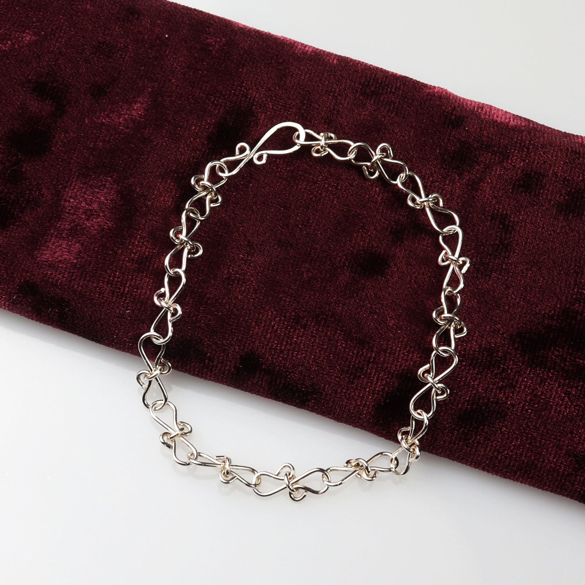 Customizable Infinity Bow Chain Bracelet in Argentium® Silver

Elevate your jewelry collection with this elegant Infinity Bow Chain Bracelet, handcrafted in our Missouri studio by Elkhorn Silver™. Made from premium Argentium® 935 sterling silver, this bracelet is hypoallergenic, tarnish-resistant, and ideal for sensitive skin.